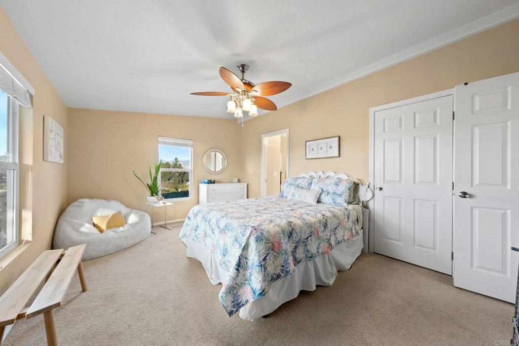 9100 Single Oak Drive, Unit 26 Lakeside, CA 92040 - Photo 5 of 46 a spacious bedroom with a bed and a window
