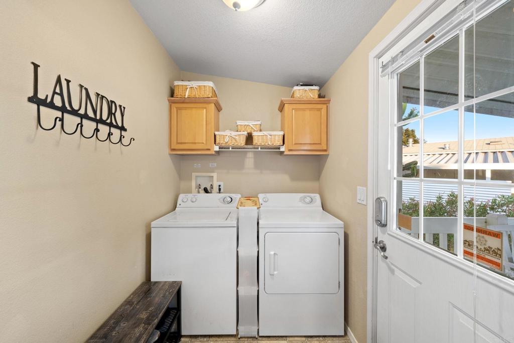9100 Single Oak Drive, Unit 26 Lakeside, CA 92040 - Photo 8 of 46 a utility room with dryer and washer