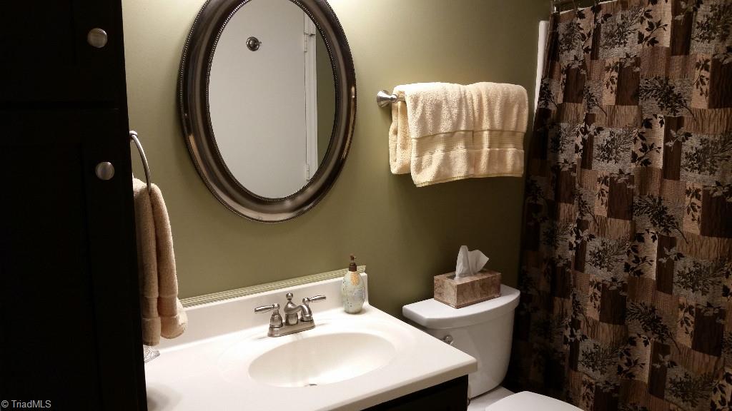 3216 Pipers Way High Point, NC 27265 - Photo 14 of 25 Updated master bath with added cabinetry for extra storage.