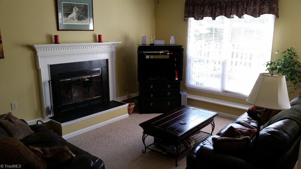 3216 Pipers Way High Point, NC 27265 - Photo 5 of 25 Cozy sunken living room with wood burning fire place and lots of natural light