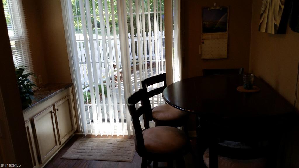 3216 Pipers Way High Point, NC 27265 - Photo 10 of 25 Breakfast area looks out onto patio.