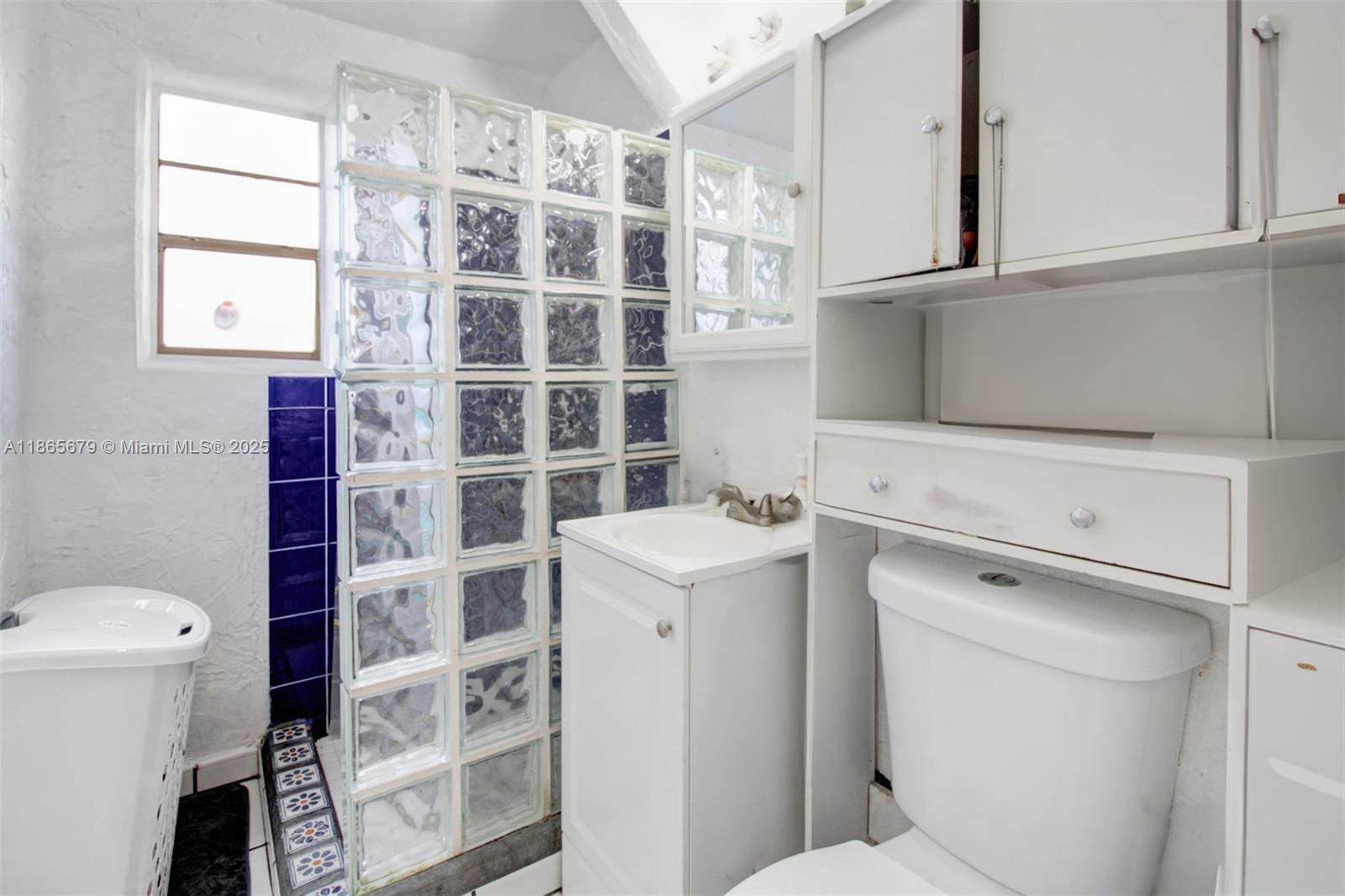 3451 Southwest 11th Street, Unit 8A Miami, FL 33135 - Photo 7 of 10 a view of walk in closet with empty racks