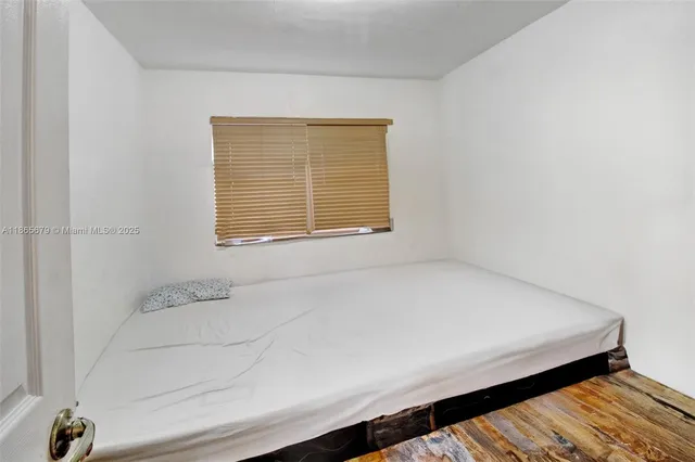 a bathroom with a bathtub and a window