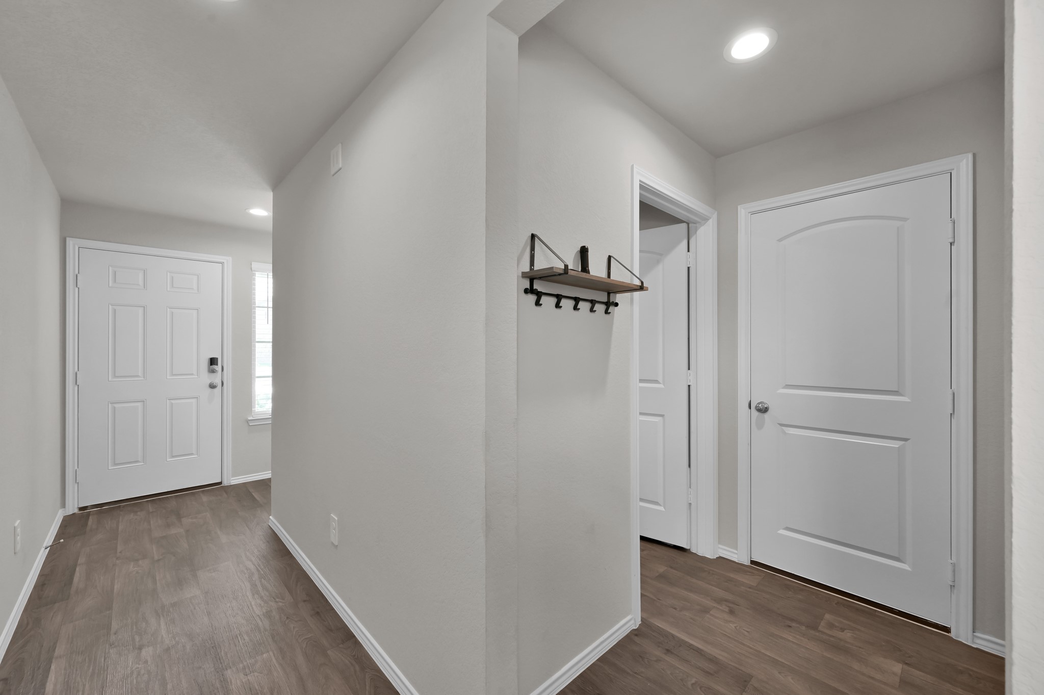 13916 Great Pnes Court Conroe, TX 77302 - Photo 3 of 22 Door to the left is the front door, door on the right leads into the garage