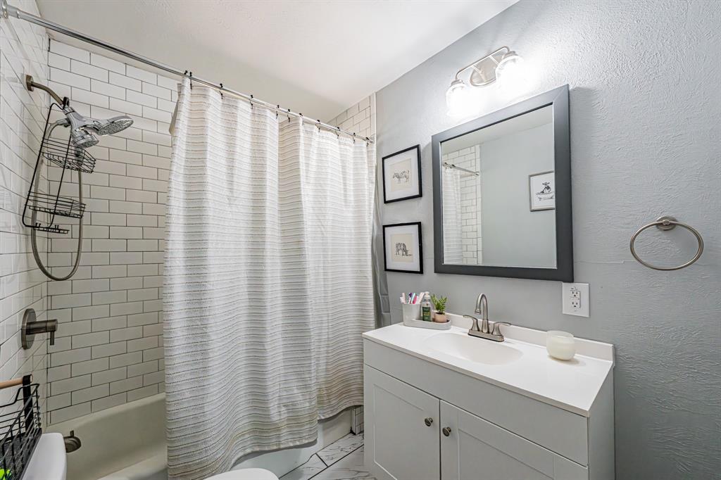 3745 Lucy Trimble Road Burleson, TX 76028 - Photo 24 of 40 a bathroom with a sink toilet and shower