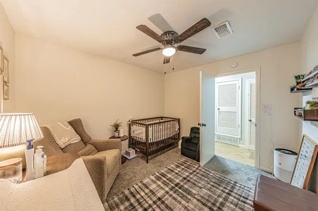 a bedroom with furniture and a window