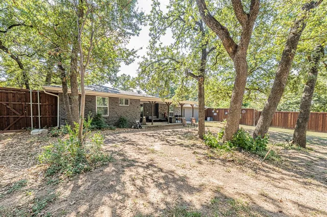 a house with trees in the background