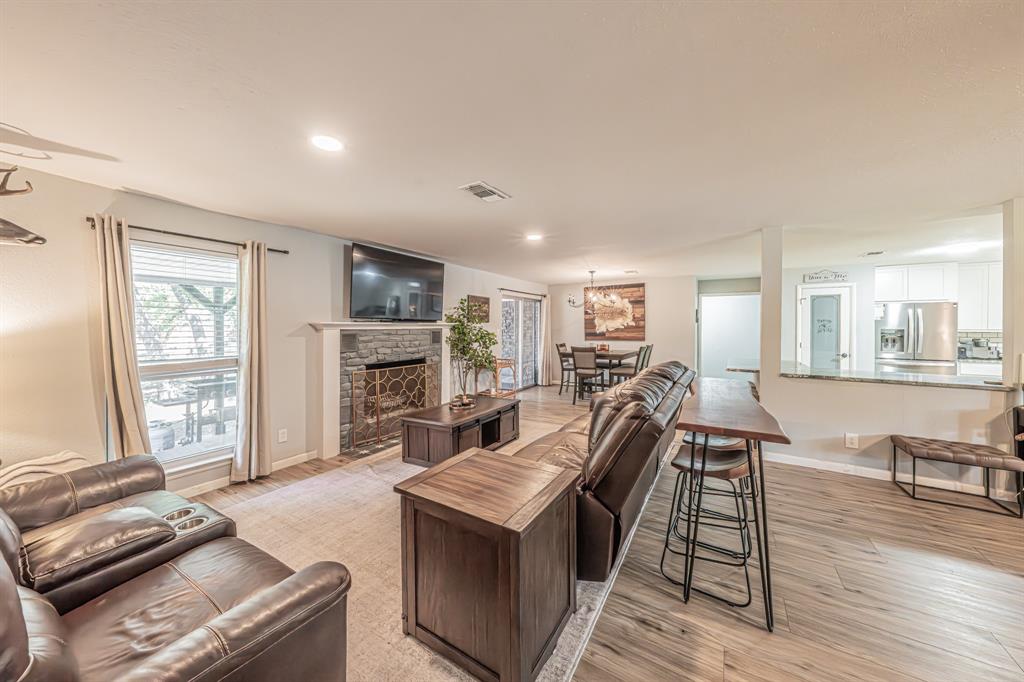 3745 Lucy Trimble Road Burleson, TX 76028 - Photo 5 of 40 a living room with furniture stove and wooden floor