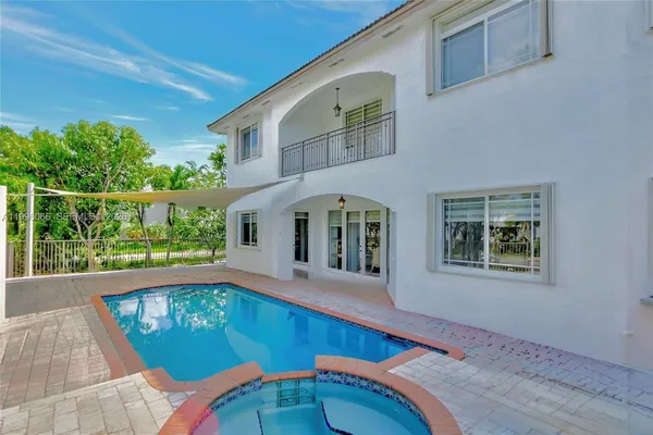 a view of a living room and balcony