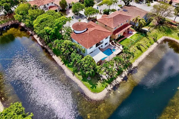 an aerial view of a house with outdoor space