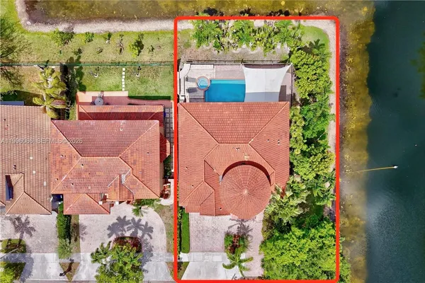 an aerial view of a house with a garden