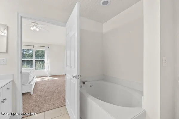 a bathroom with a bathtub and shower