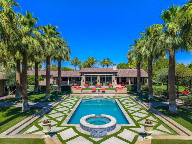 a living room with fireplace furniture and a flat screen tv