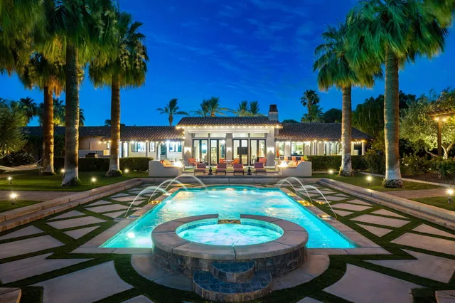 a view of a patio with swimming pool table and chairs