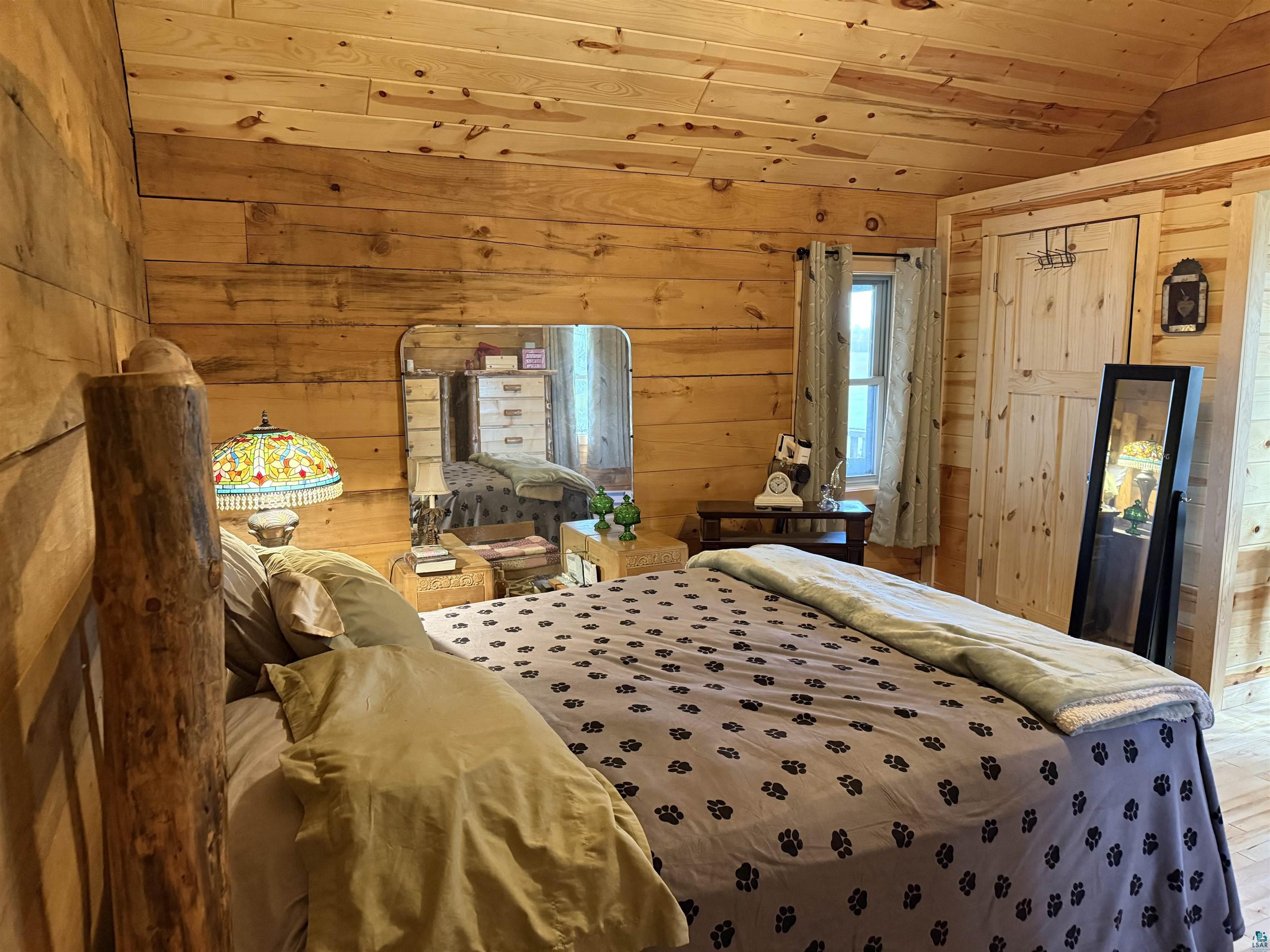 37590 Degerstrom Road Askov, MN 55704 - Photo 16 of 53 Warm interior featuring wood-paneled walls and ceiling