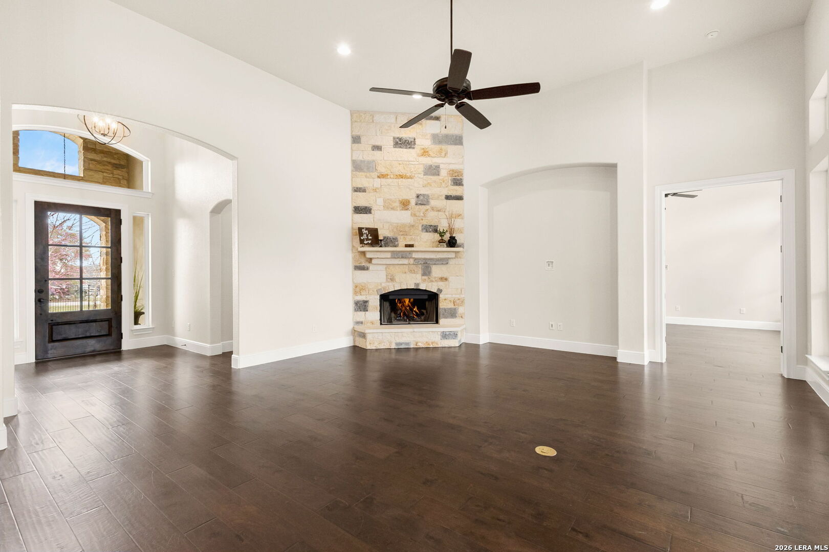 1217 Paladin Trail Spring Branch, TX 78070 - Photo 12 of 53 a view of a livingroom with wooden floor a ceiling fan and windows