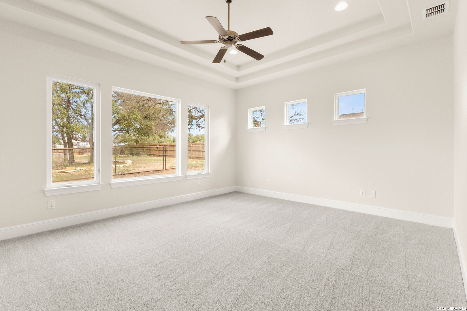 1217 Paladin Trail Spring Branch, TX 78070 - Photo 20 of 53 an empty room with windows and fan