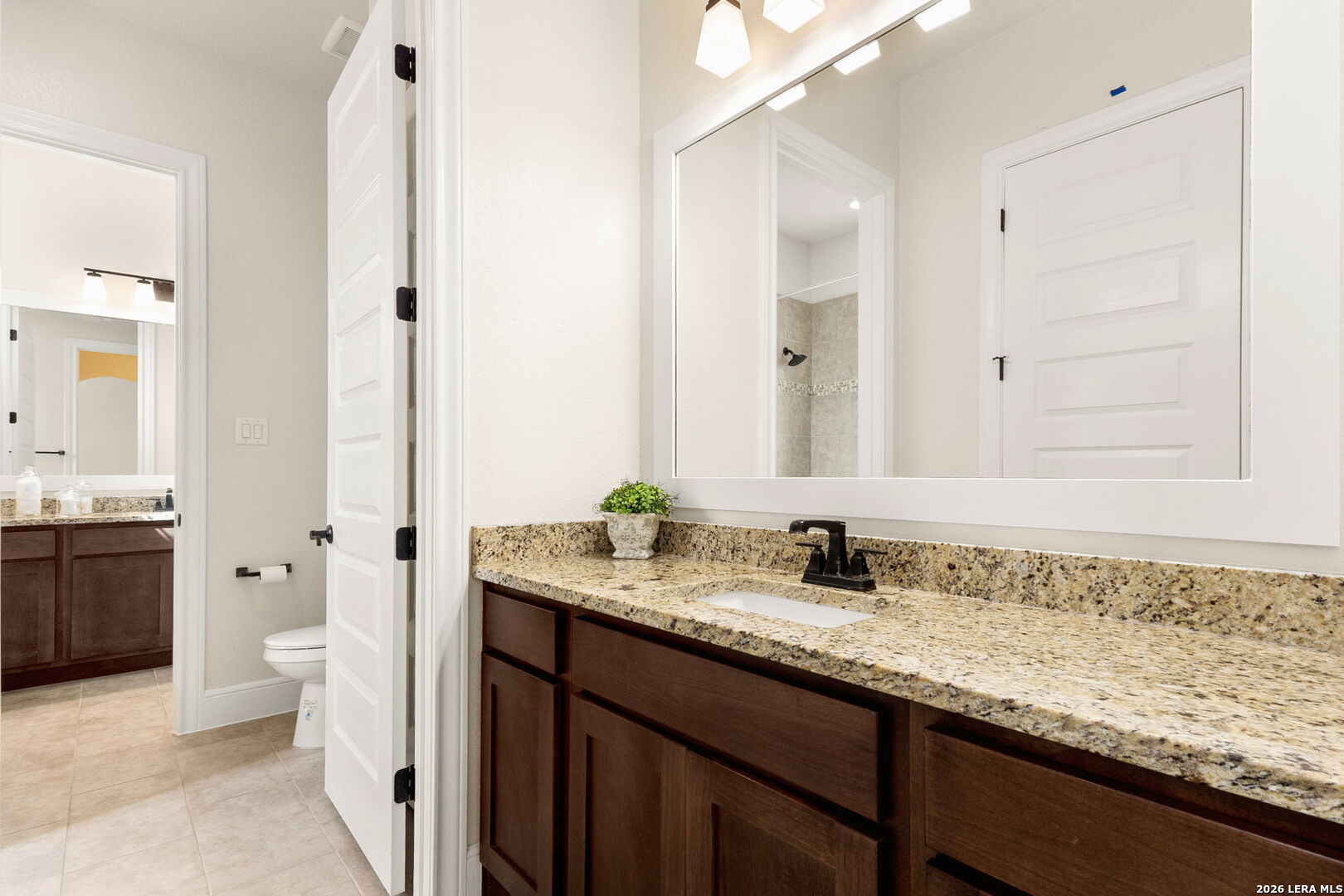 1217 Paladin Trail Spring Branch, TX 78070 - Photo 29 of 53 a bathroom with a granite countertop sink and a mirror