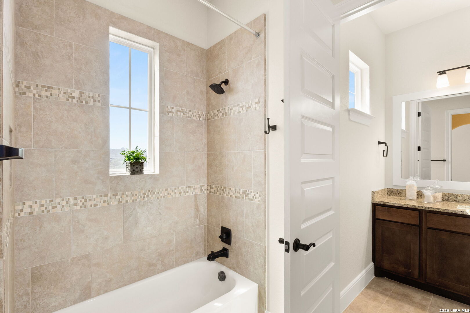 1217 Paladin Trail Spring Branch, TX 78070 - Photo 30 of 53 a bathroom with a tub shower vanity and a sink