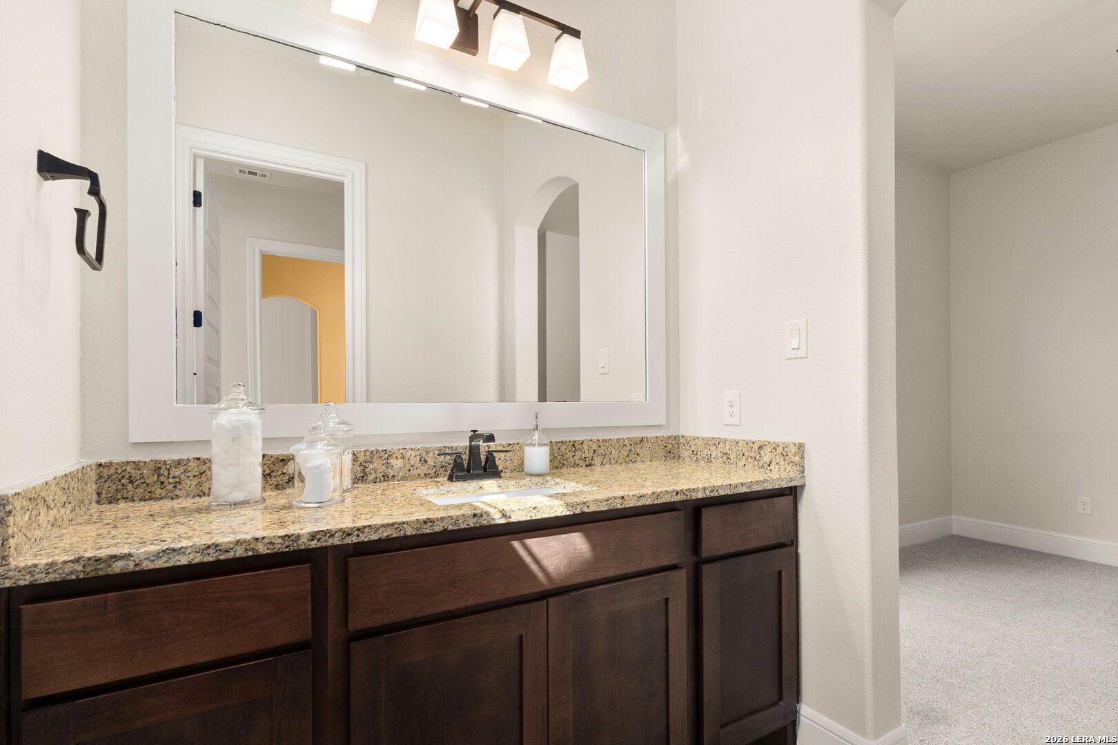 1217 Paladin Trail Spring Branch, TX 78070 - Photo 31 of 53 a bathroom with a granite countertop sink and a mirror