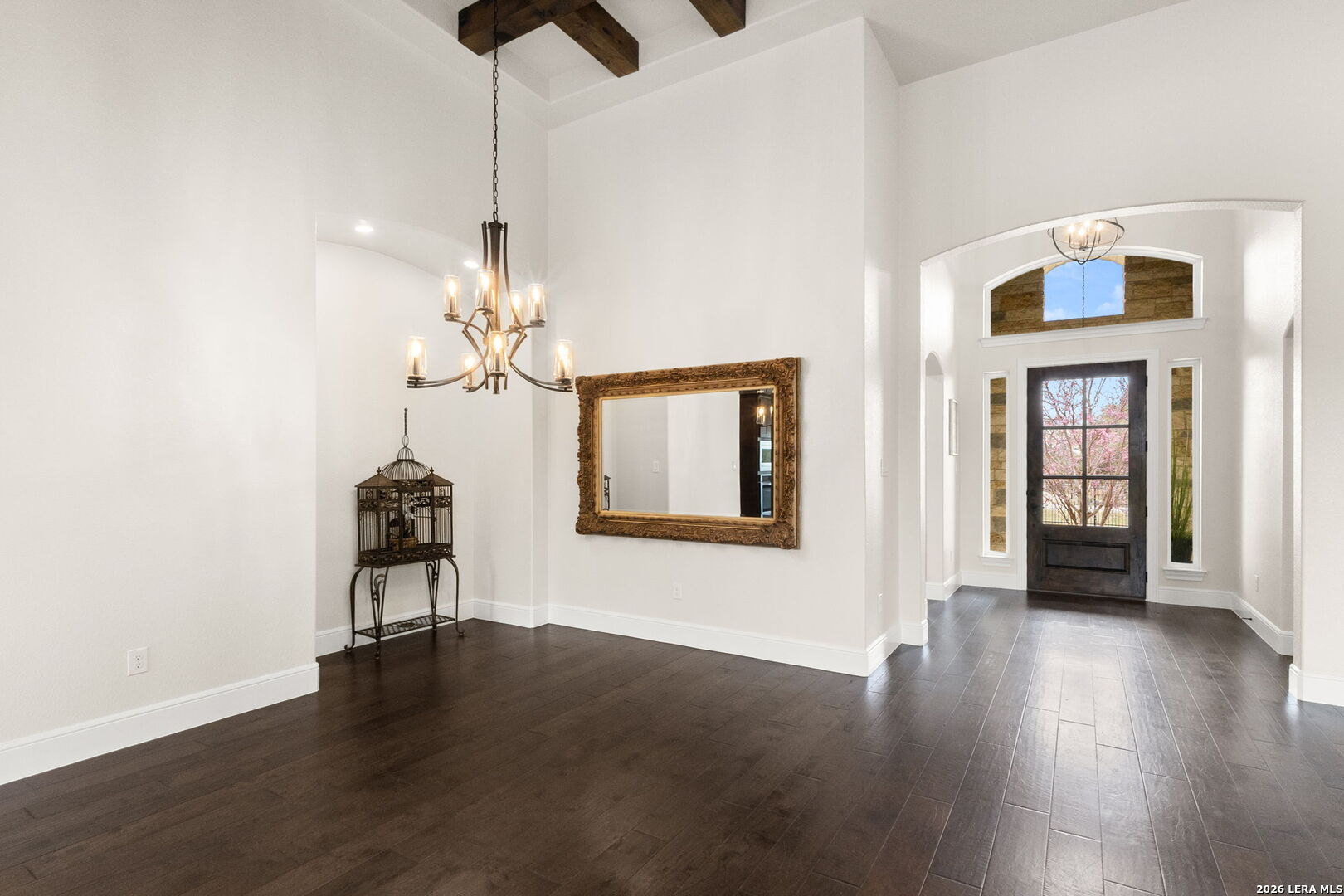 1217 Paladin Trail Spring Branch, TX 78070 - Photo 7 of 53 a view of an empty room with window and wooden floor