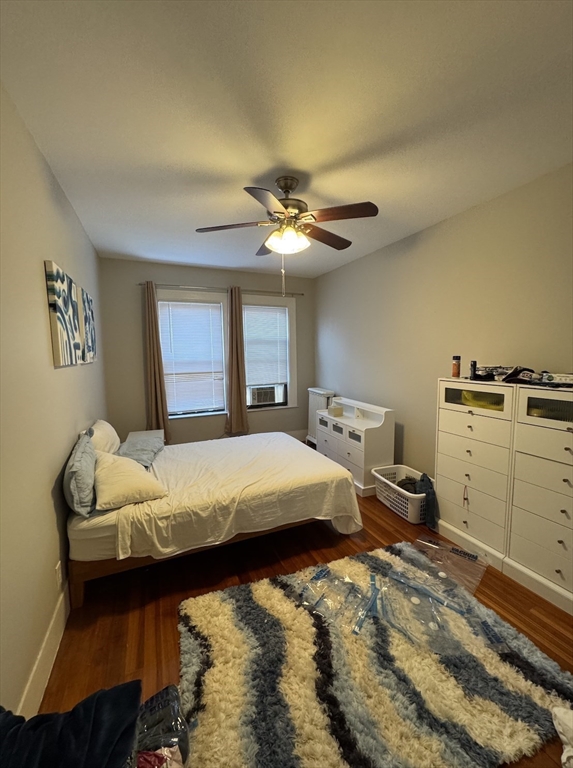 9 Sewall Avenue, Unit 314 Brookline, MA 02446 - Photo 5 of 12 a bed room with a bed and a ceiling fan