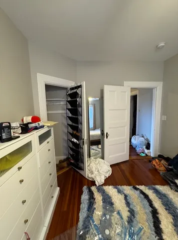 a bathroom with a sink mirror vanity and toilet