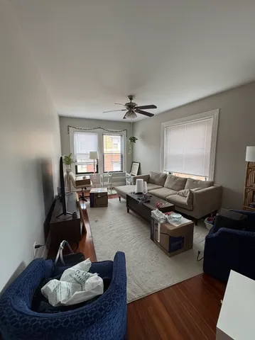 a kitchen with stainless steel appliances kitchen island granite countertop a sink dishwasher stove and refrigerator