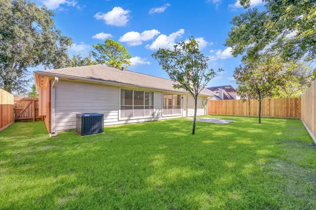 a view of a house with a backyard porch and sitting area