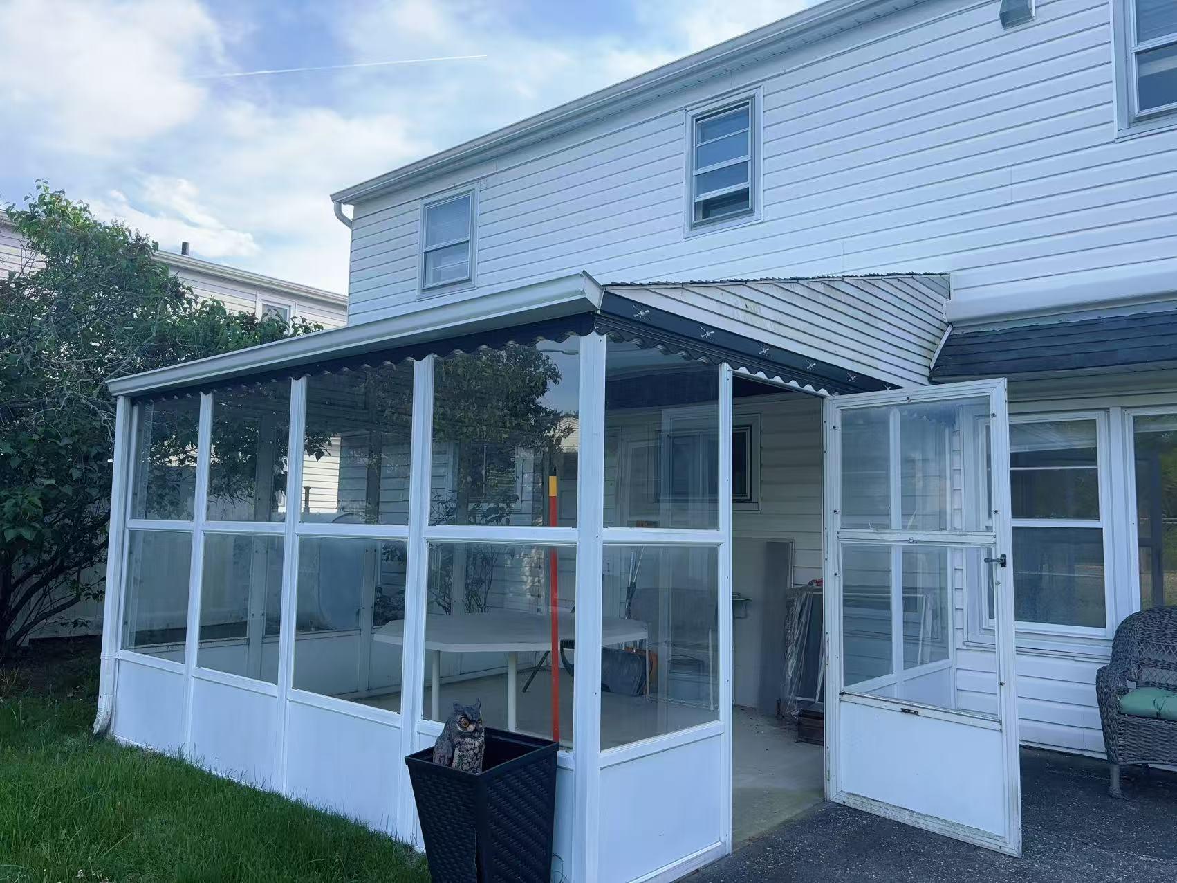 2333 Beech Street Wantagh, NY 11793 - Photo 19 of 21 View of side of property featuring a sunroom