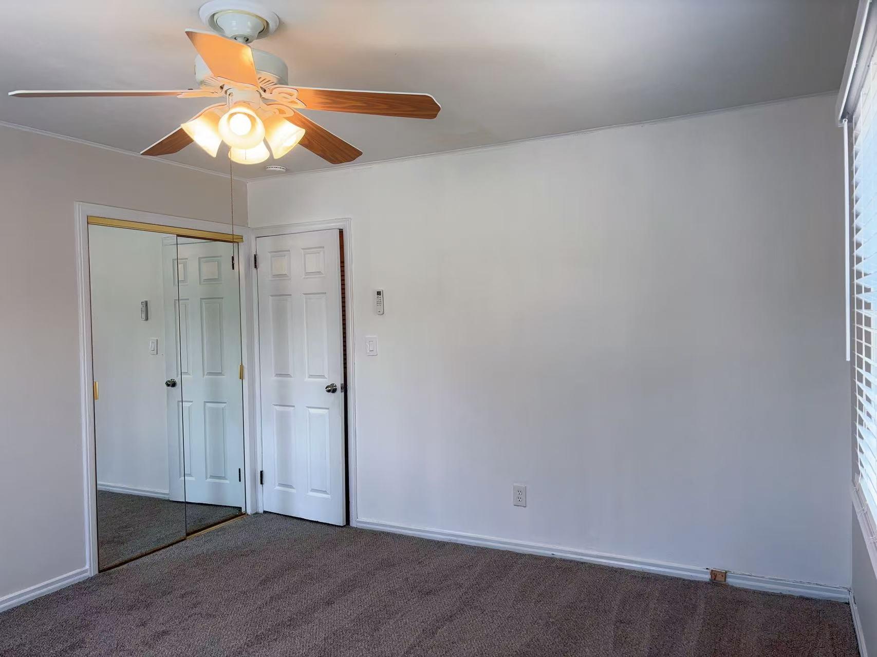 2333 Beech Street Wantagh, NY 11793 - Photo 5 of 21 Unfurnished bedroom with carpet, a ceiling fan, and a closet