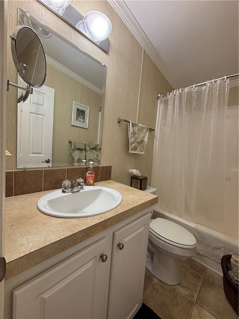6171 98th Road Sebastian, FL 32958 - Photo 14 of 14 a bathroom with a sink toilet and shower