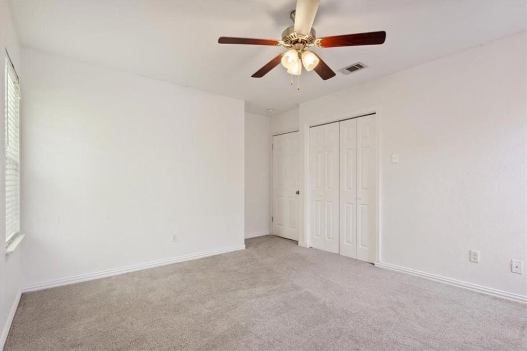 2306 Melissa Drive Waco, TX 76708 - Photo 18 of 22 an empty room with a fan and a fan
