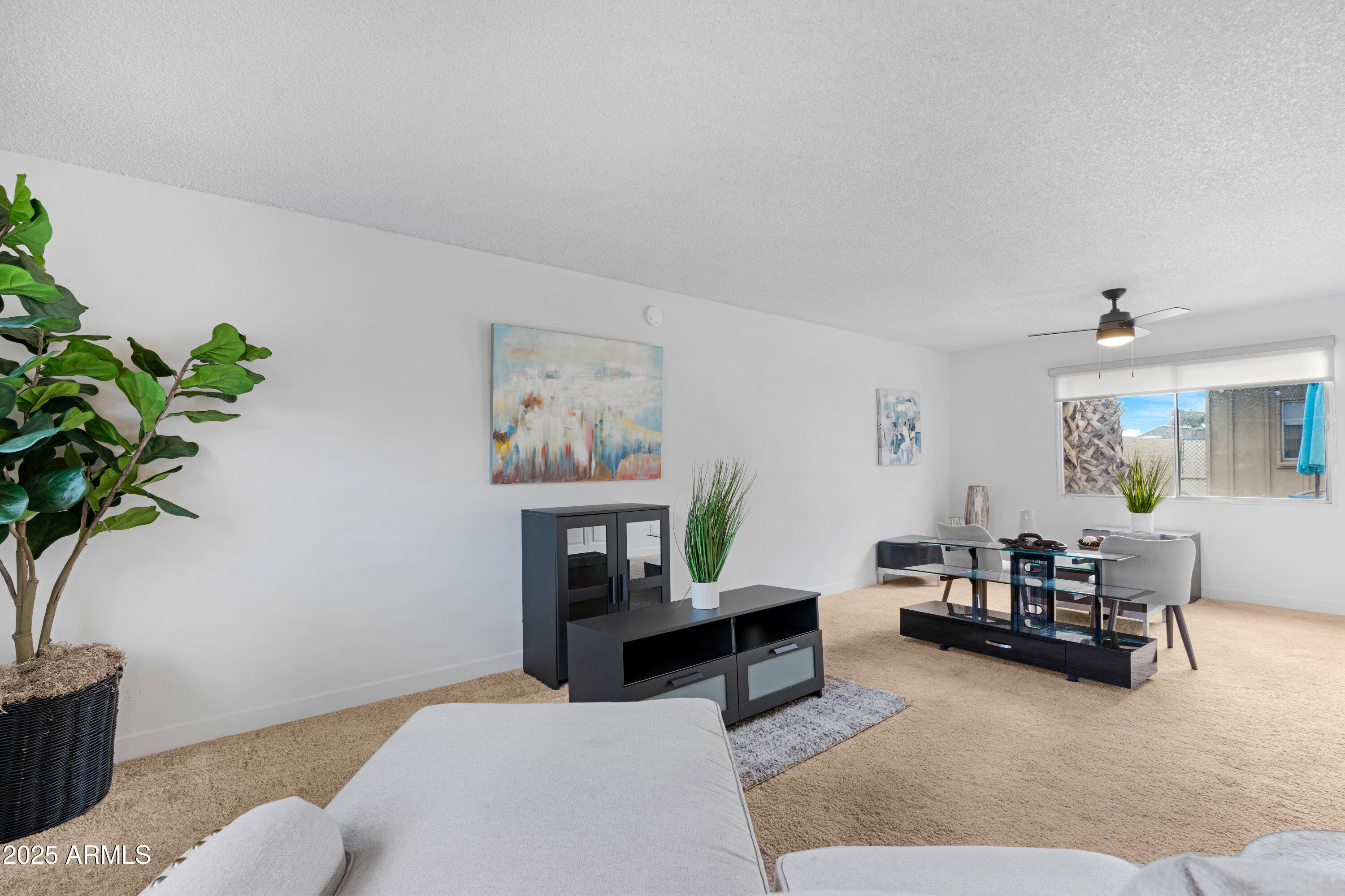 2042 West Elm Street Phoenix, AZ 85015 - Photo 11 of 35 a living room with furniture and a potted plant