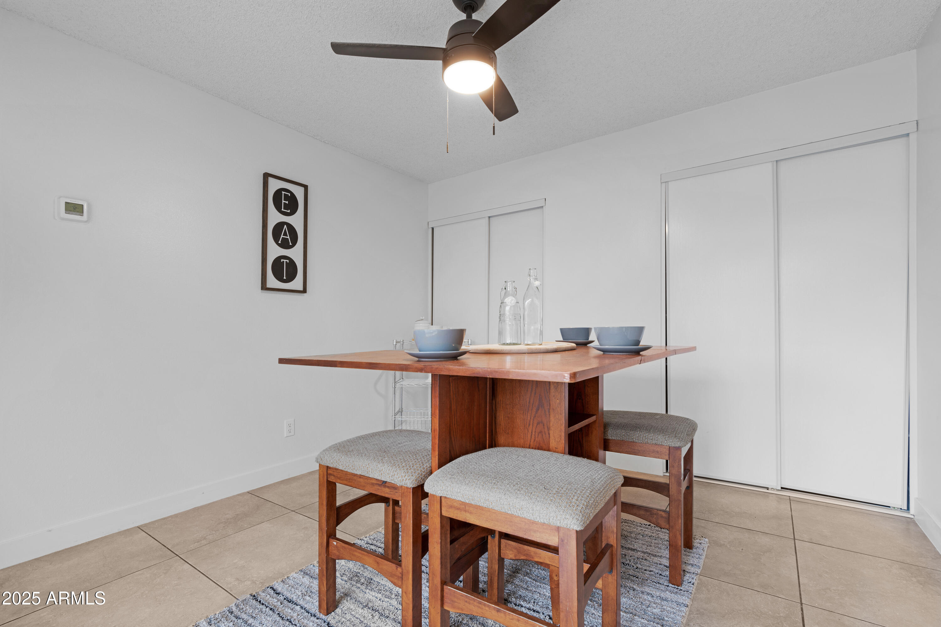 2042 West Elm Street Phoenix, AZ 85015 - Photo 19 of 35 a view of a room that has a table and chairs in it