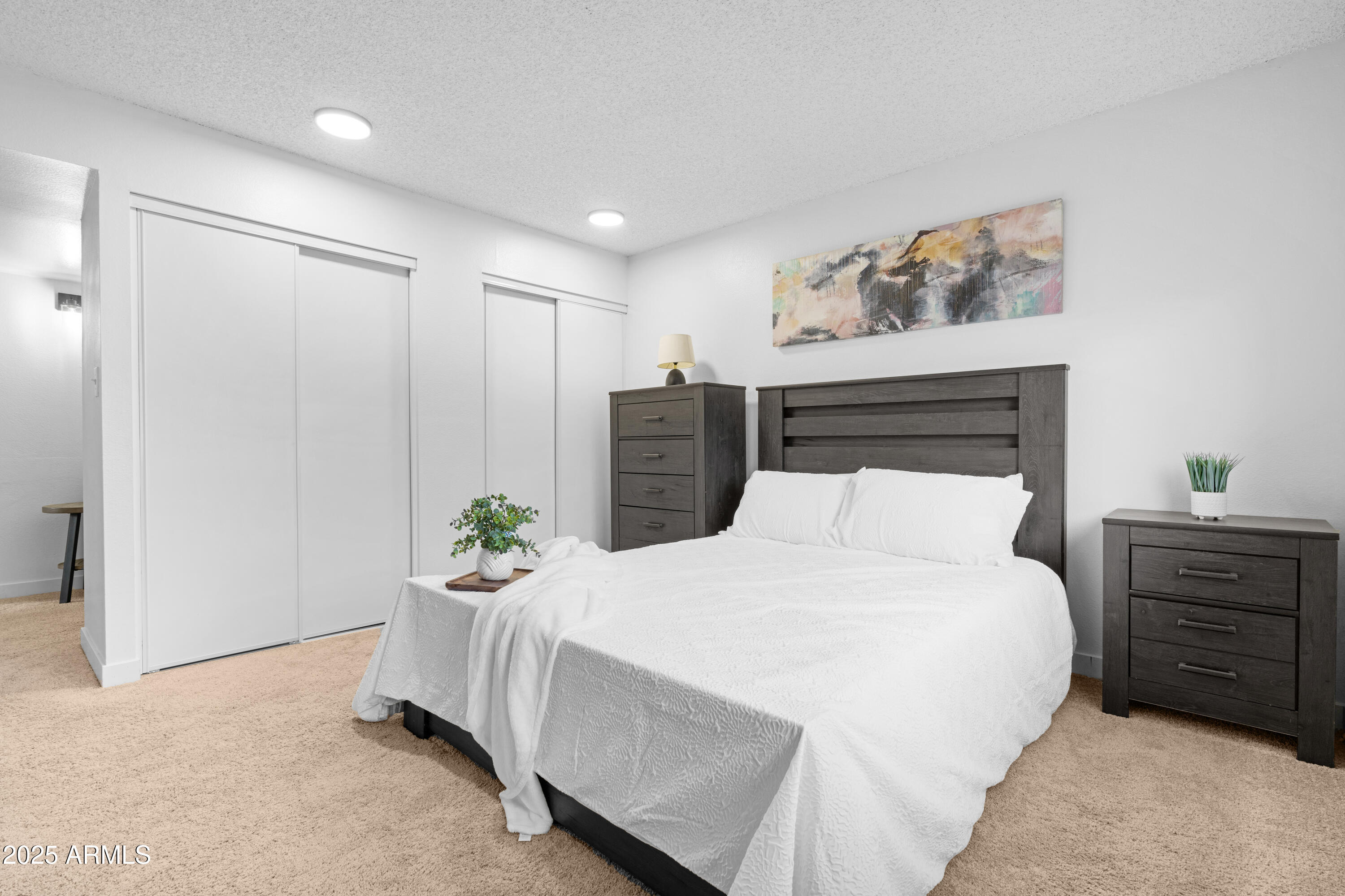 2042 West Elm Street Phoenix, AZ 85015 - Photo 22 of 35 a bedroom with a bed table and window