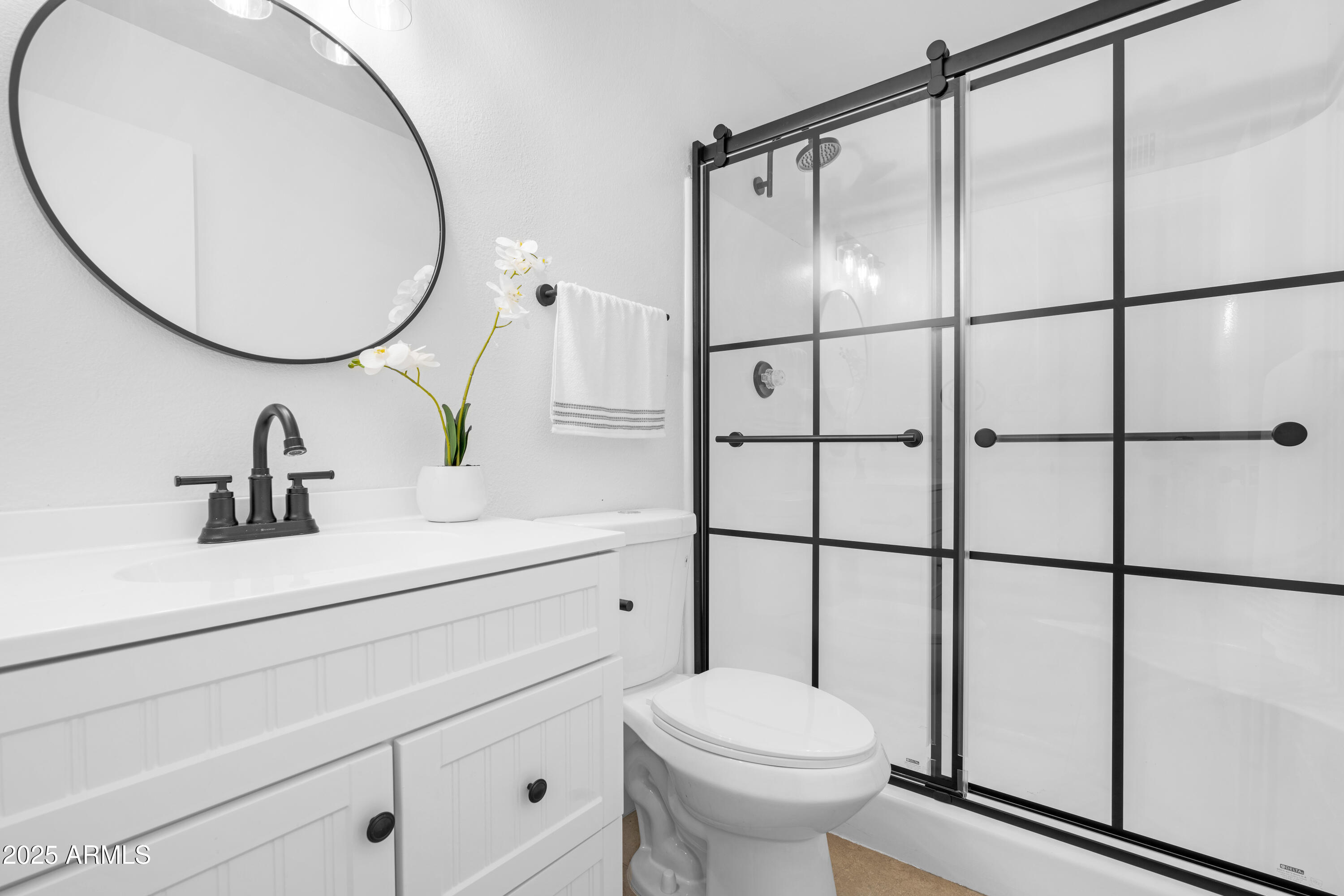 2042 West Elm Street Phoenix, AZ 85015 - Photo 25 of 35 a bathroom with a sink a toilet and a mirror