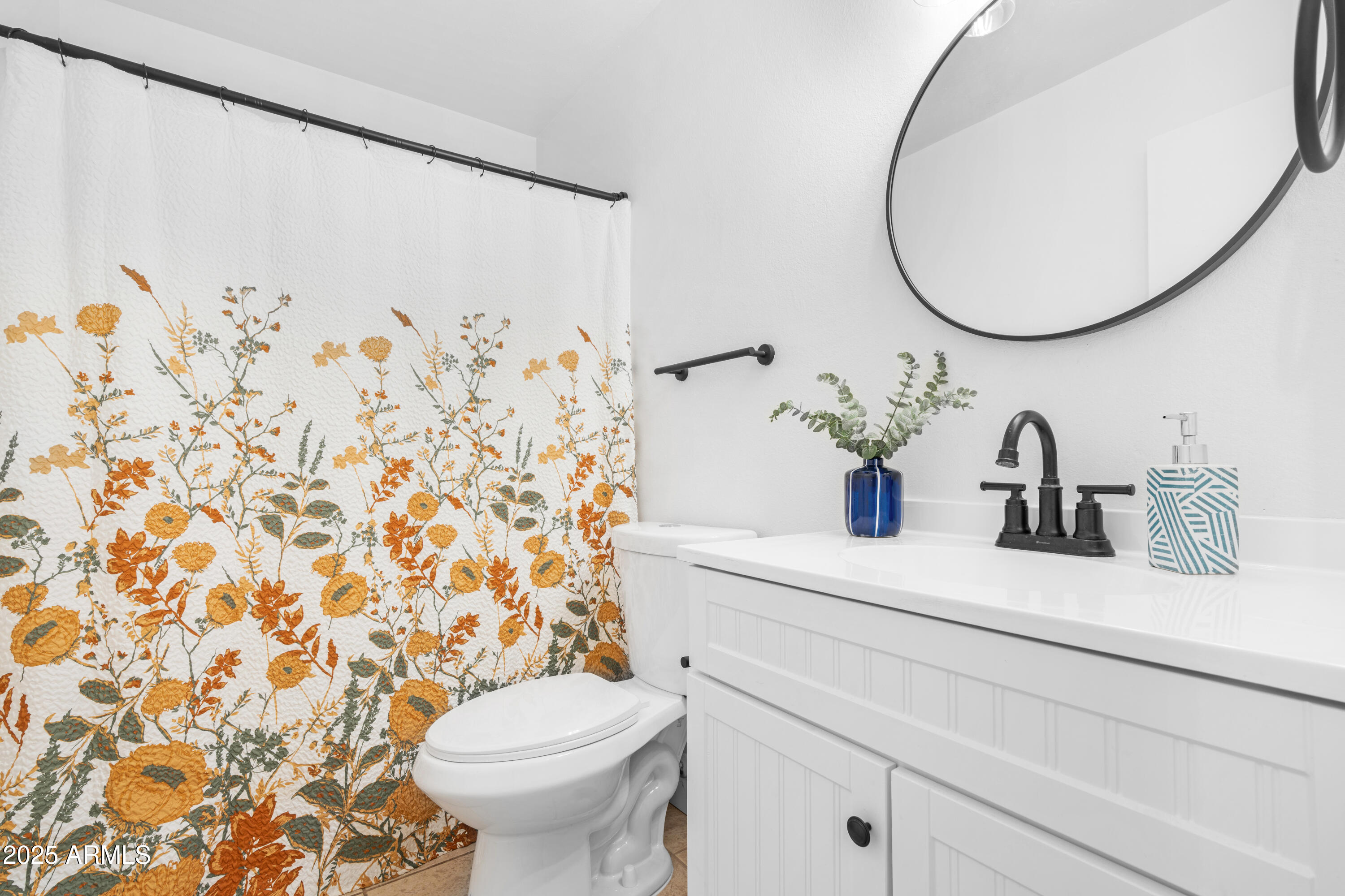 2042 West Elm Street Phoenix, AZ 85015 - Photo 28 of 35 a bathroom with a sink and a mirror