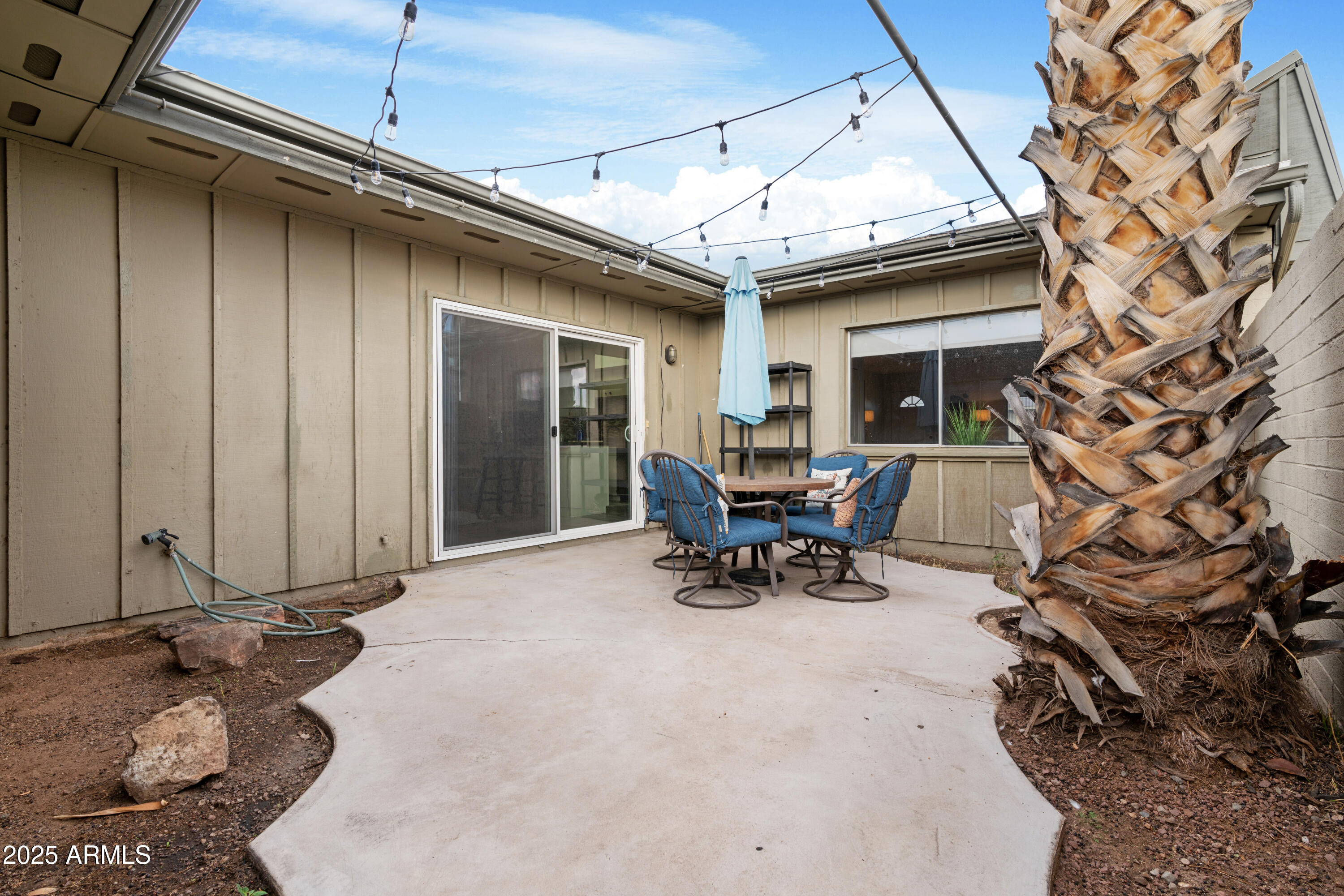 2042 West Elm Street Phoenix, AZ 85015 - Photo 33 of 35 a view of a patio with table and chairs and potted plants