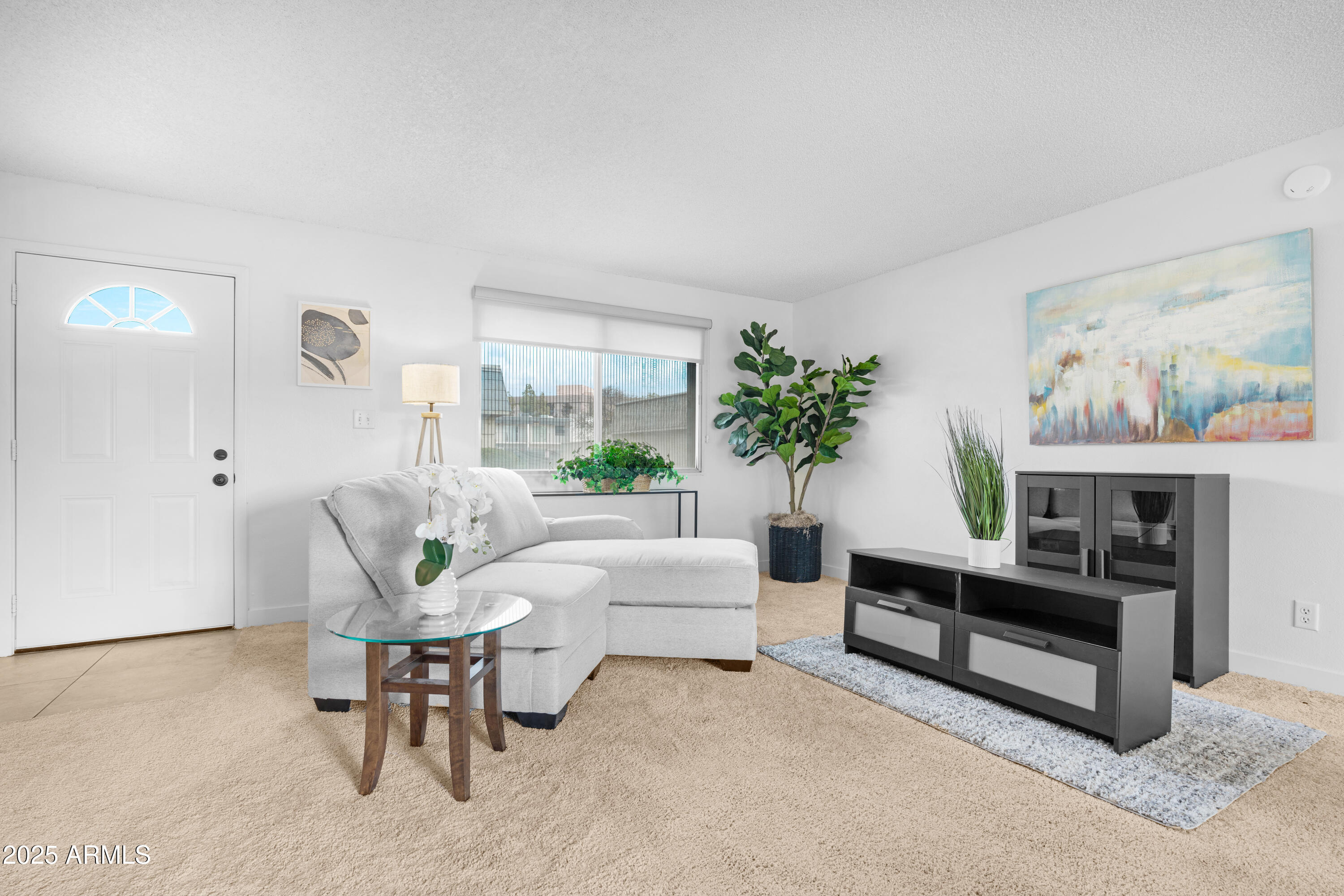 2042 West Elm Street Phoenix, AZ 85015 - Photo 9 of 35 a living room with furniture and a fireplace