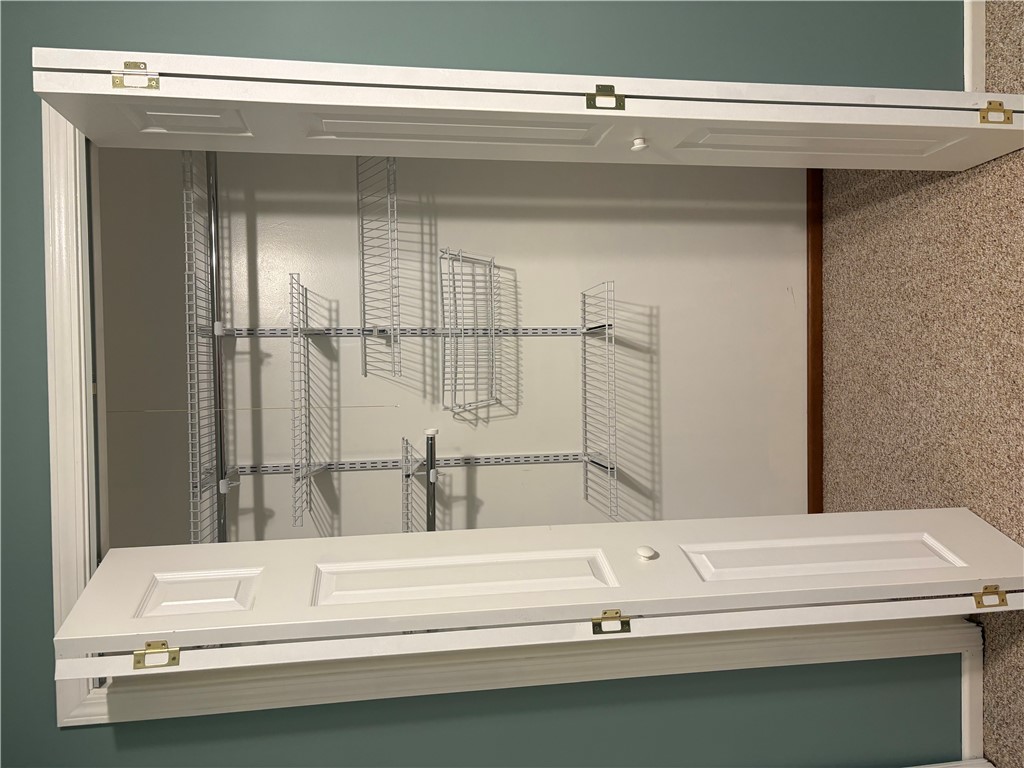 306 Hemlock Avenue Anderson, SC 29625 - Photo 10 of 25 Organized wire shelving provides practical storage options behind folding closet doors.