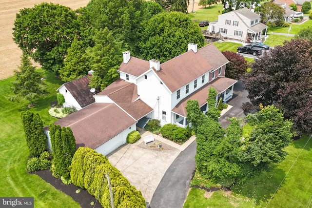 an aerial view of a house with a garden