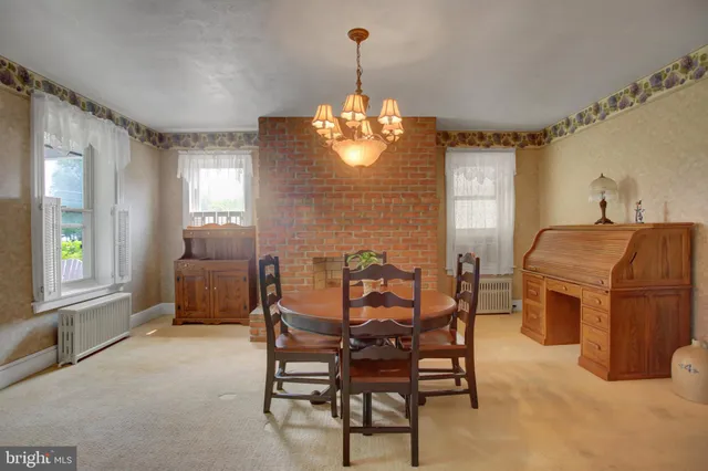 a dining room with furniture and window