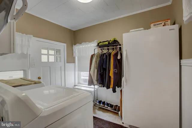 a view of a hallway view with wooden floor and staircase