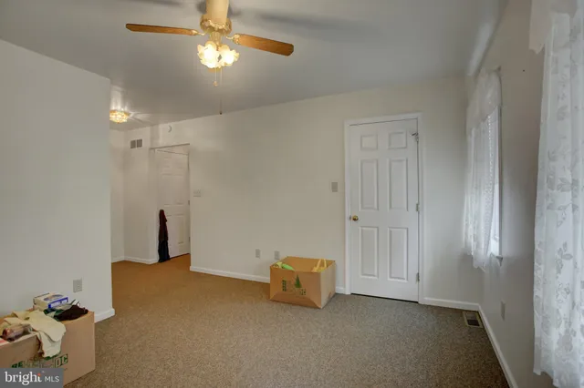 a view of a garden with a building in the background