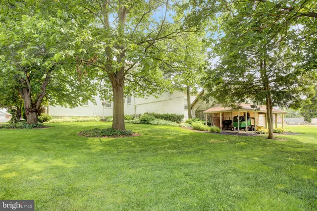 an aerial view of a residential apartment building with a yard