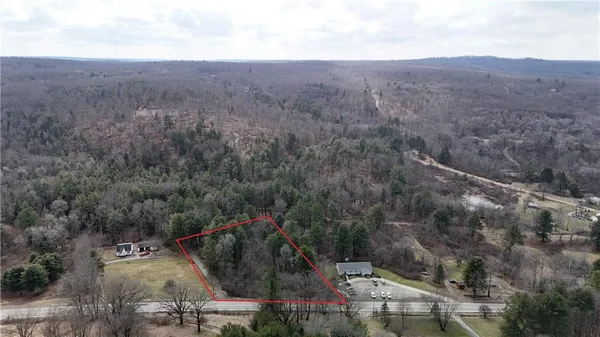 an aerial view of house with yard and mountain view