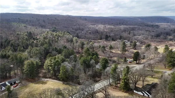 an aerial view of residential house and green space