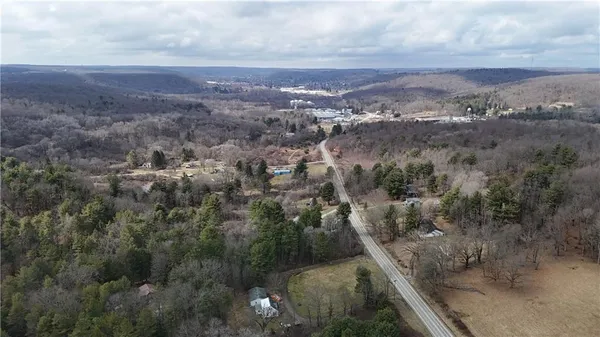 an aerial view of residential house and green space