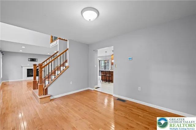 a view of an entryway with wooden floor